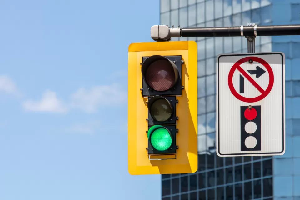 Stoplight with green light and "no right turn on red" pictograph on overhead signal